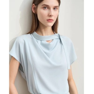 A sophisticated light blue women's dress featuring a unique neckline detail, perfect for fashion-forward individuals seeking elegant, chic clothing options from Monalisa Store.