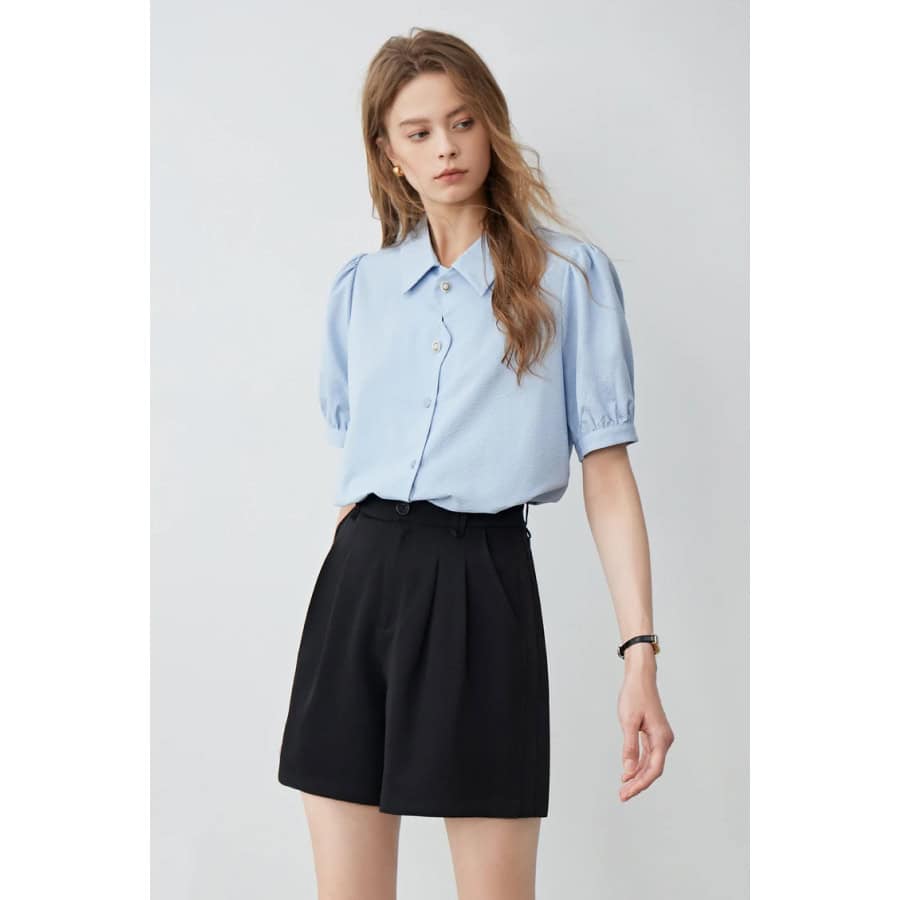 A fashionable young woman wearing stylish smart casual eyeglasses, showcasing modern eyewear trends for women.