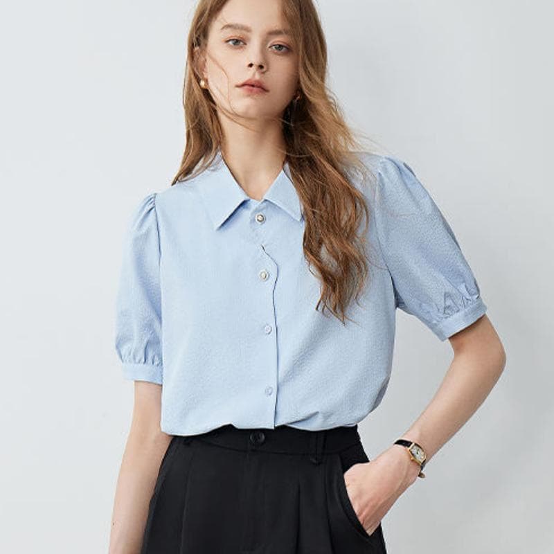 Stylish light blue women's blouse with puff sleeves, perfect for office or casual wear, from Monalisa Store.