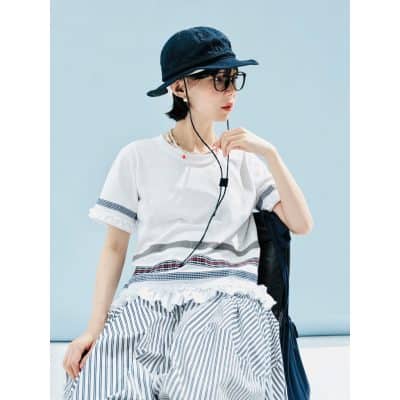 Stylish woman with glasses and hat, showcasing trendy fashion accessories at Monalisa Store for eye health, eyewear shopping, and fashionable eyewear options.