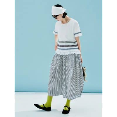 A fashionable woman wearing trendy eyewear and stylish clothing, showcasing innovative eye care products from Monalisa Store. Perfect for enhancing your vision and style.