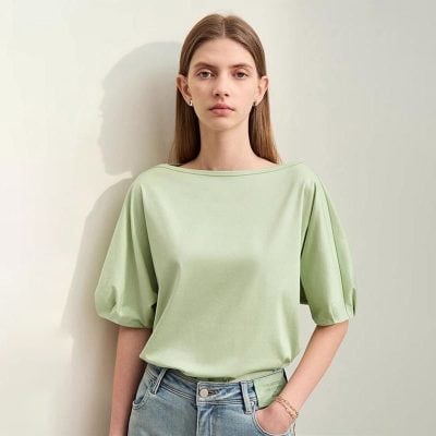 A stylish light green blouse with puffed sleeves from Monalisa Store, perfect for casual and everyday fashion, offering a comfortable yet chic look for women.