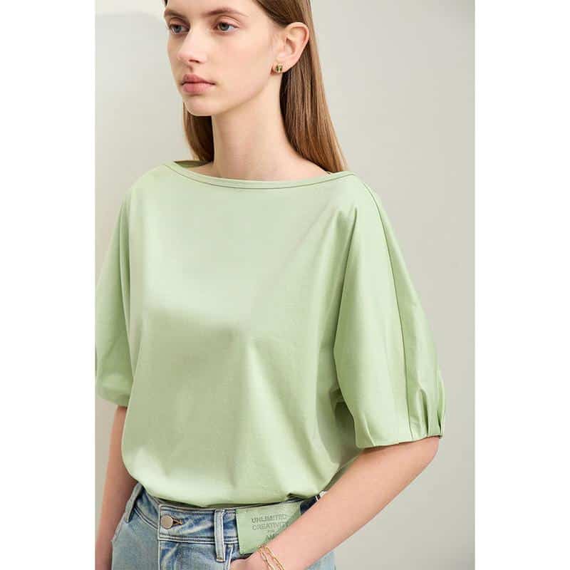 Bright lime green casual top with puffed sleeves, round neckline, and comfortable fit, ideal for everyday wear or stylish outings. Perfect for adding a pop of color to your wardrobe.
