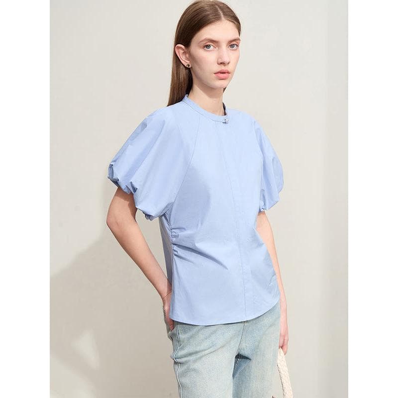 Comfortable light blue medical scrub top with puff sleeves, perfect for nurses, doctors, and clinic staff seeking trendy, functional workwear.