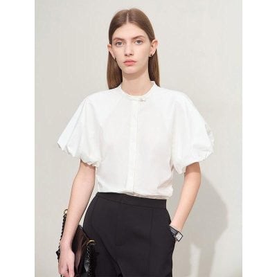 Stylish white puff-sleeve blouse perfect for professional and casual settings, offering comfortable fit and timeless design for women.