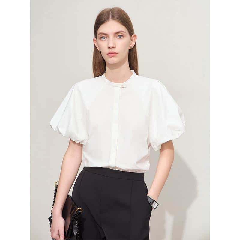 Stylish white puff-sleeve blouse perfect for professional and casual settings, offering comfortable fit and timeless design for women.