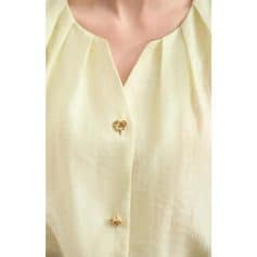 Optometry store fashion blouse, stylish blouse with gold button accents, perfect for optical shop staff or optometrists, trendy professional eyewear store outfit, Monalisa Medical branding.