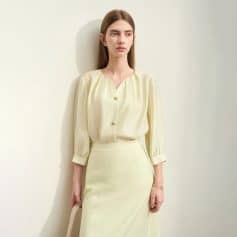 Elegant women's cream blouse with gold button details, perfect for office or casual wear, available at Monalisa Store. Comfortable and stylish for modern women.