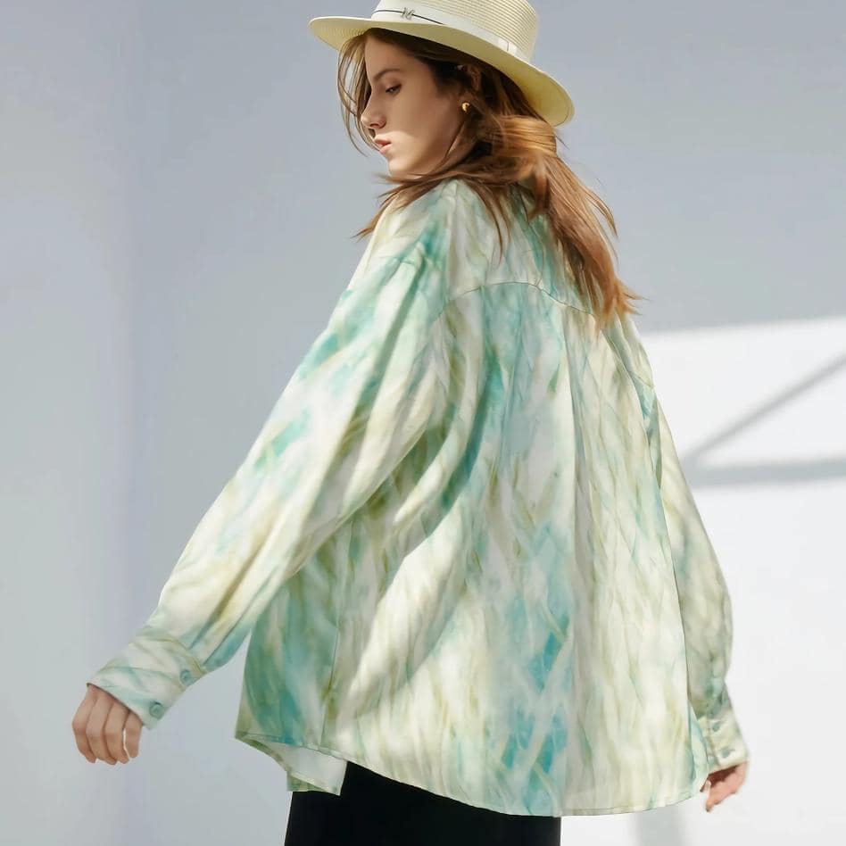 Fashionable women's tie-dye jacket with a relaxed fit, vibrant colors, and lightweight fabric, perfect for casual outings and stylish coverage.
