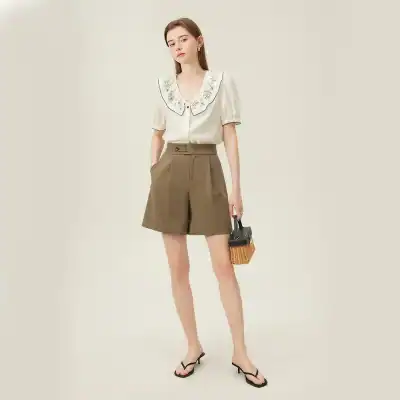 Spotlighted in a chic, minimal background, this modern women's fashion ensemble emphasizes comfort and style, making it ideal for summer wear, casual outings, or urban streetwear.