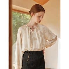 High-quality silk blouse for women, perfect for office and casual occasions, featuring a chic silk fabric, unique neckline, and comfortable fit in a neutral color.