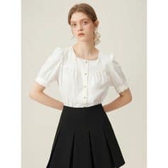 A stylish white blouse designed for women, featuring puff sleeves, a classic round neckline, and gold buttons, ideal for professional or casual wear.
