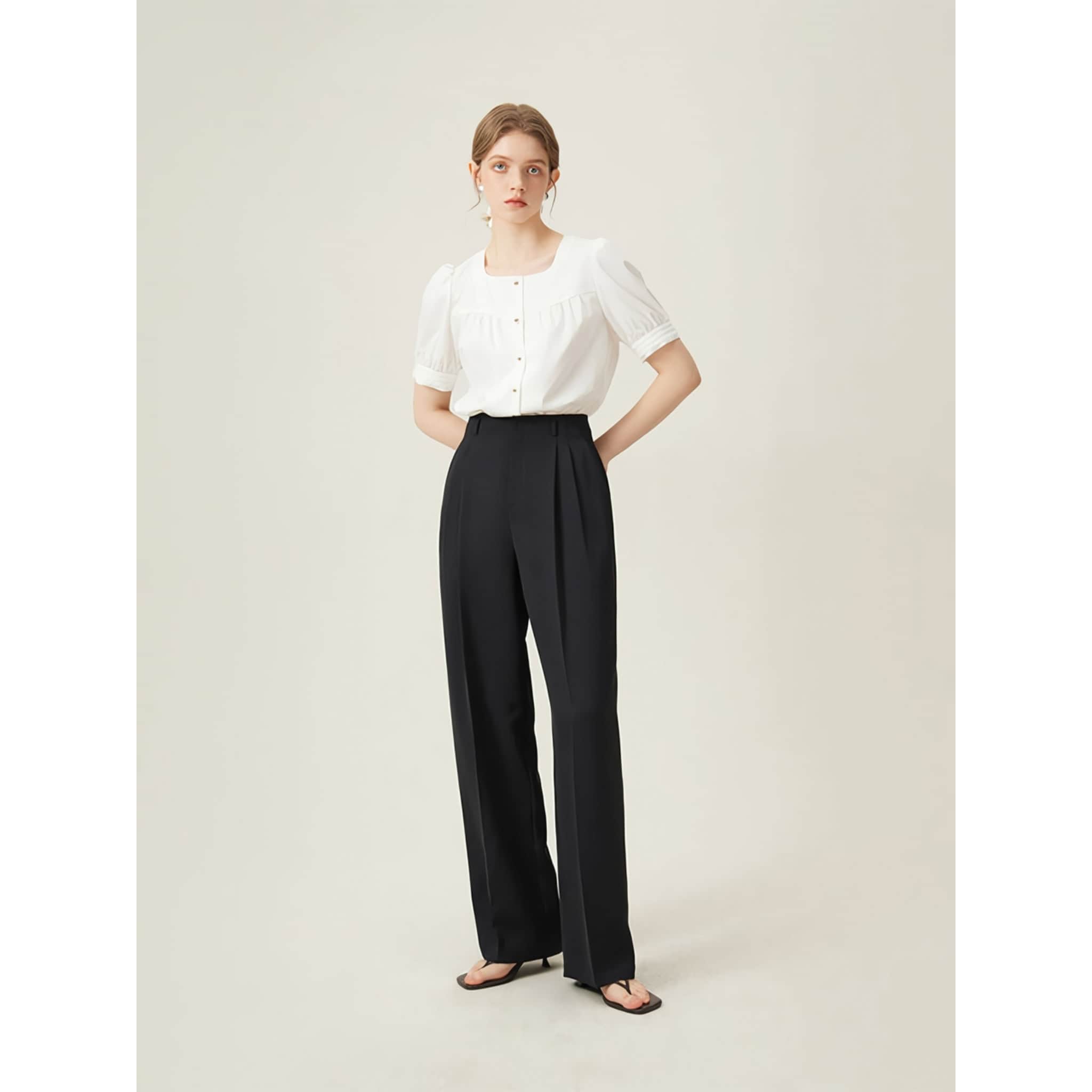 Highly stylish and comfortable women's black wide-leg trousers paired with a white blouse, ideal for medical, office, or casual wear.