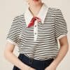This image features a fashionable women's blouse with classic black and white horizontal stripes complemented by a red silk necktie, creating a chic and professional look suitable for office or casual settings, available at Monalisa Medical store.