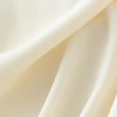 Cream-colored fabric with a smooth texture, ideal for medical and aesthetic applications, highlighting quality and sophistication.