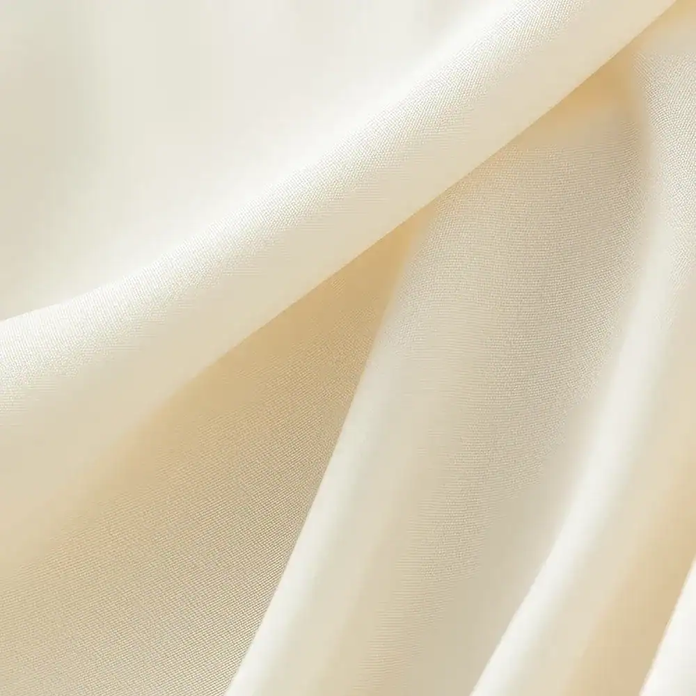 Cream-colored fabric with a smooth texture, ideal for medical and aesthetic applications, highlighting quality and sophistication.