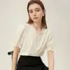 Stylish women's linen blouse with delicate embroidery, button-down front, and ruffled sleeves, perfect for casual and formal occasions.