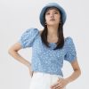 Stylish blue floral puff sleeve blouse perfect for summer, available at Monalisa Medical Store. Elevate your casual look with trendy and comfortable fashion essentials.