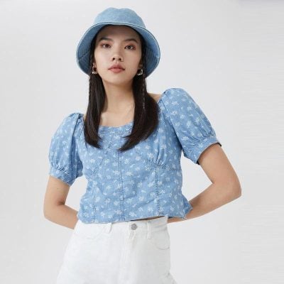 A trendy blue floral summer top with puff sleeves, perfect for a fashionable and comfortable look, available at Monalisa Medical Store for eyewear and optical accessories.