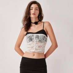 Elegant lace lingerie top with black and white design, adjustable spaghetti straps, perfect for stylish sleepwear or intimate apparel.