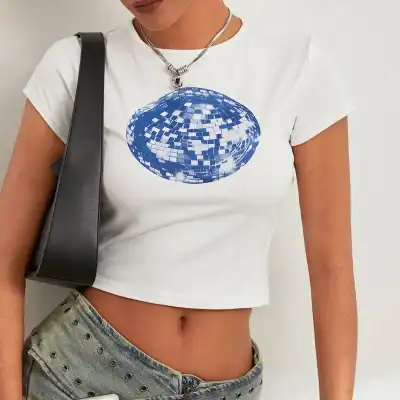 Stylish white crop top with blue disco mirror design, perfect for trendy fashion statements and casual outings.