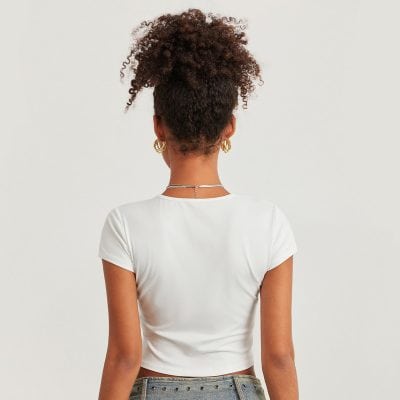 Stylish white crop top for women, perfect for casual and trendy outfits. Made with high-quality fabric, comfortable fit, and versatile style for everyday wear.