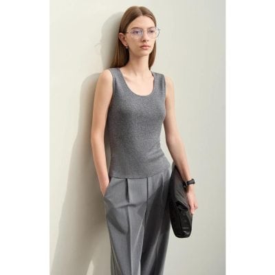 Alt text: Sophisticated woman wearing stylish transparent glasses and casual gray outfit, showcasing modern eyewear at Monalisa Store for premium optical products.