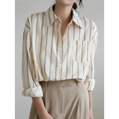 Stylish women's striped button-up blouse perfect for office or casual wear, available at Monalisa Store. Elevate your wardrobe with classic, versatile fashion essentials.