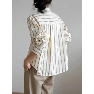 Stylish women's striped button-up shirt featuring a relaxed fit, soft fabric, and classic design ideal for casual or office wear. Perfect for a chic, comfortable look.