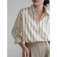 Elegant women's striped blouse ideal for office or casual wear, featuring a classic collar, button-up front, and comfortable fit for professional or everyday fashion.