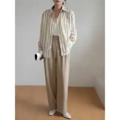 Elegant beige striped shirt with wide-leg trousers for office and casual wear.