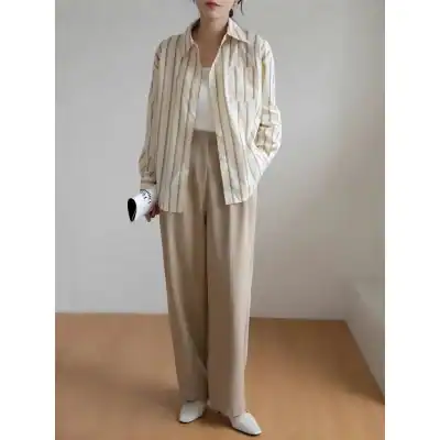 Elegant beige striped shirt with wide-leg trousers for office and casual wear.