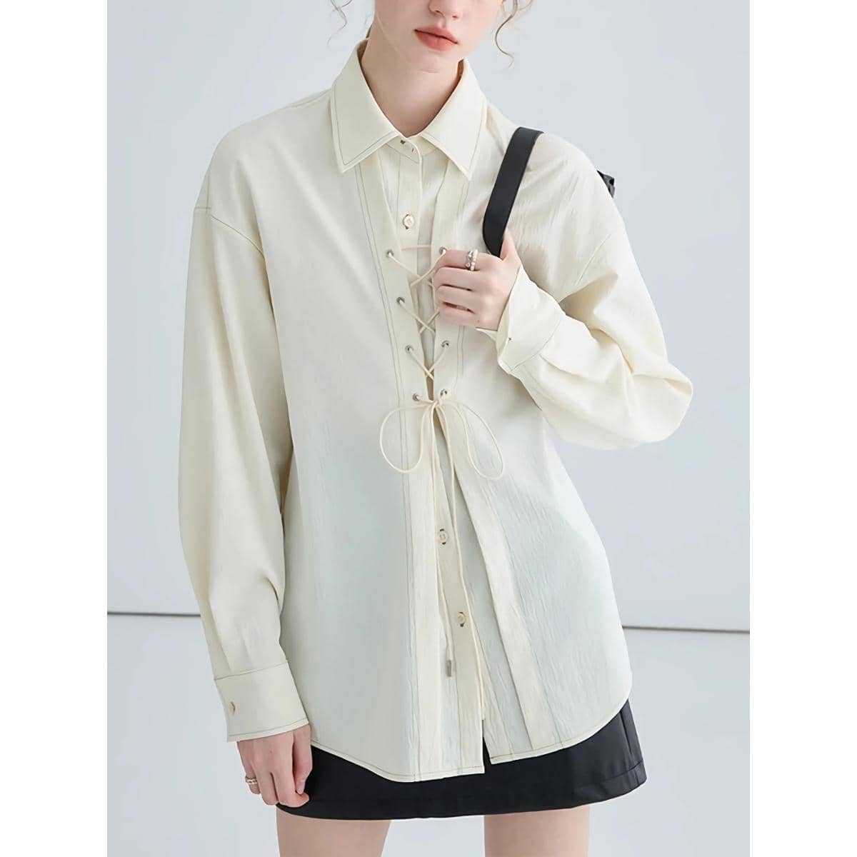 Elegant women's shirt jacket with lace-up front design, suitable for versatile fashion styles. Made from premium materials, ideal for casual outings or professional settings, combining comfort with style.
