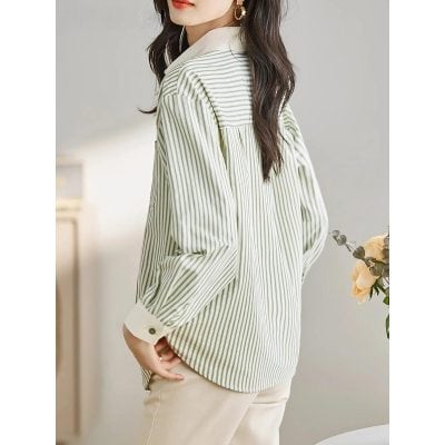 A stylish women's striped blouse featuring a relaxed fit, buttoned cuffs, and classic design—perfect for casual or business wear at Monalisa Medical Store.