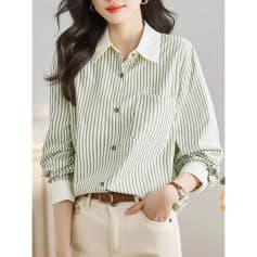 Optical clear image of a woman wearing a stylish striped button-up shirt with a white collar, perfect for office or casual wear.