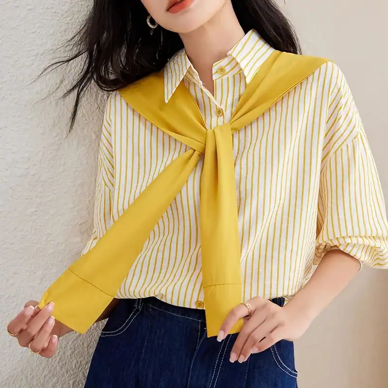 Light yellow and white striped women's shirt paired with a stylish yellow scarf tied around the neck. Perfect for casual or business casual look, versatile and trendy.