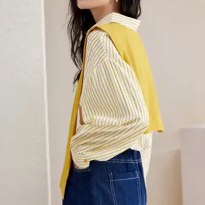Elegant yellow and white striped blouse with long sleeves, stylish design perfect for casual or professional wear.