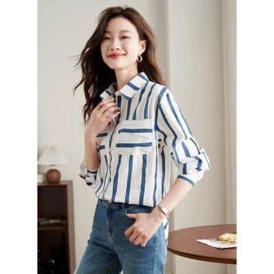 Elegant striped women's blouse for fashion and office wear. Perfect for casual or formal occasions, offering comfort and trendy style.