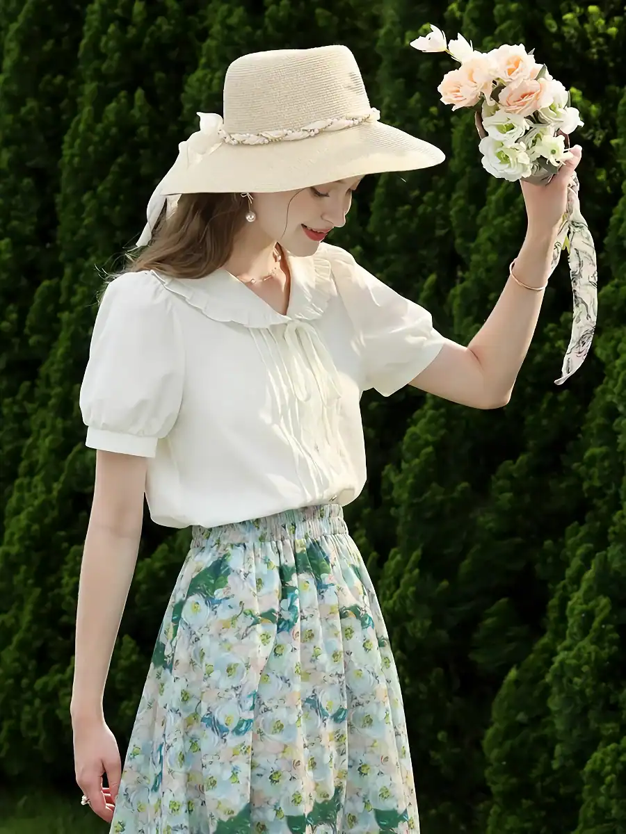 Stylish wide-brimmed straw hat with decorative ribbon adds charm to summer outfits.