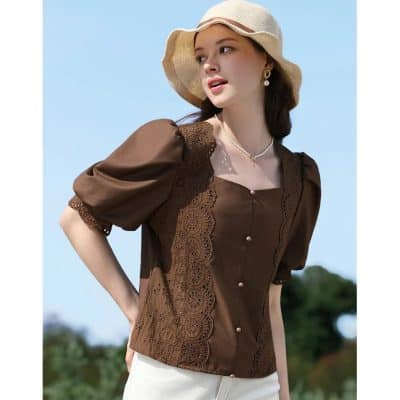 Stylish women's brown summer blouse with lace details and puff sleeves, perfect for sunny days and outdoor activities.