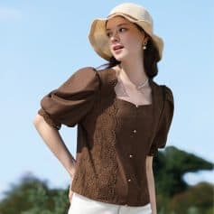 Smart casual brown blouse with puffed sleeves, lace accents, and pearl buttons, perfect for sunny days and outdoor events.