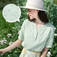 Optical-enhanced breathable blouse with embroidered details, perfect for sunny days and outdoor activities. Designed for comfort and style, great for women visiting Monalisa Store.