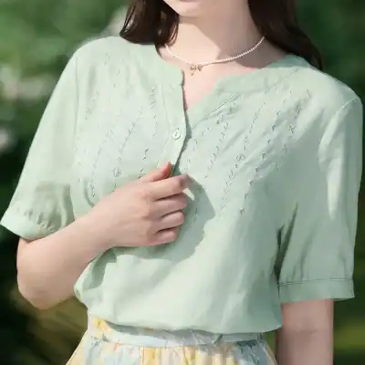 Embroidered women’s casual shirt featuring intricate embroidery, lightweight fabric, and comfortable fit, perfect for stylish everyday wear.