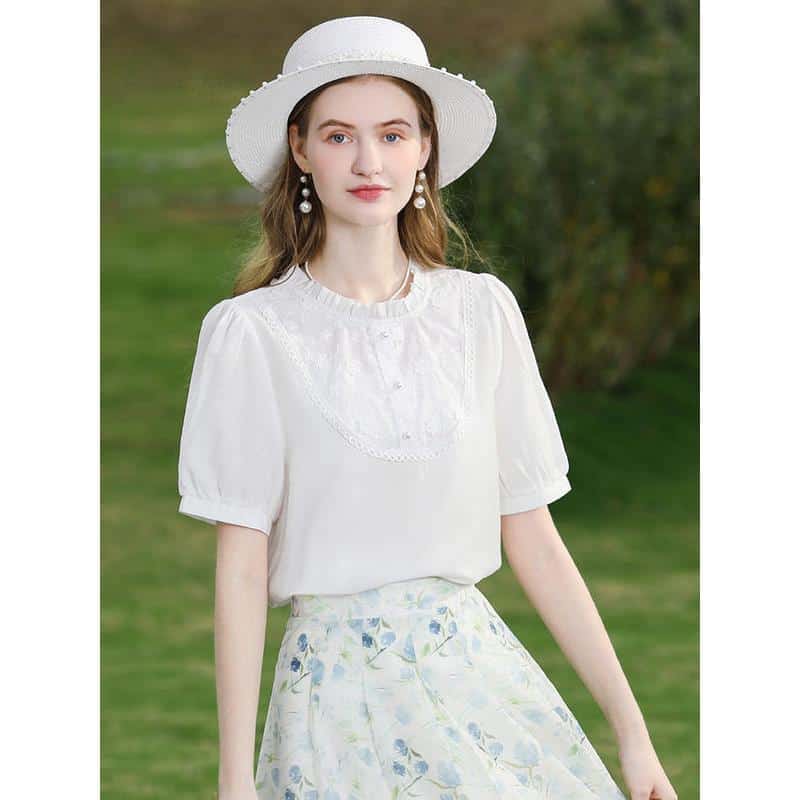Young woman wearing stylish white summer dress and sun hat, perfect for outdoor holidays or casual outings. Emphasizes fashionable and comfortable clothing for women.
