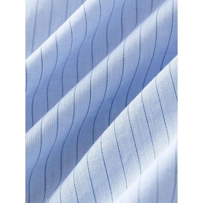 Close-up of a light blue men's dress shirt fabric with navy pinstripes, showing fine stitching and premium quality material ideal for tailored shirts.