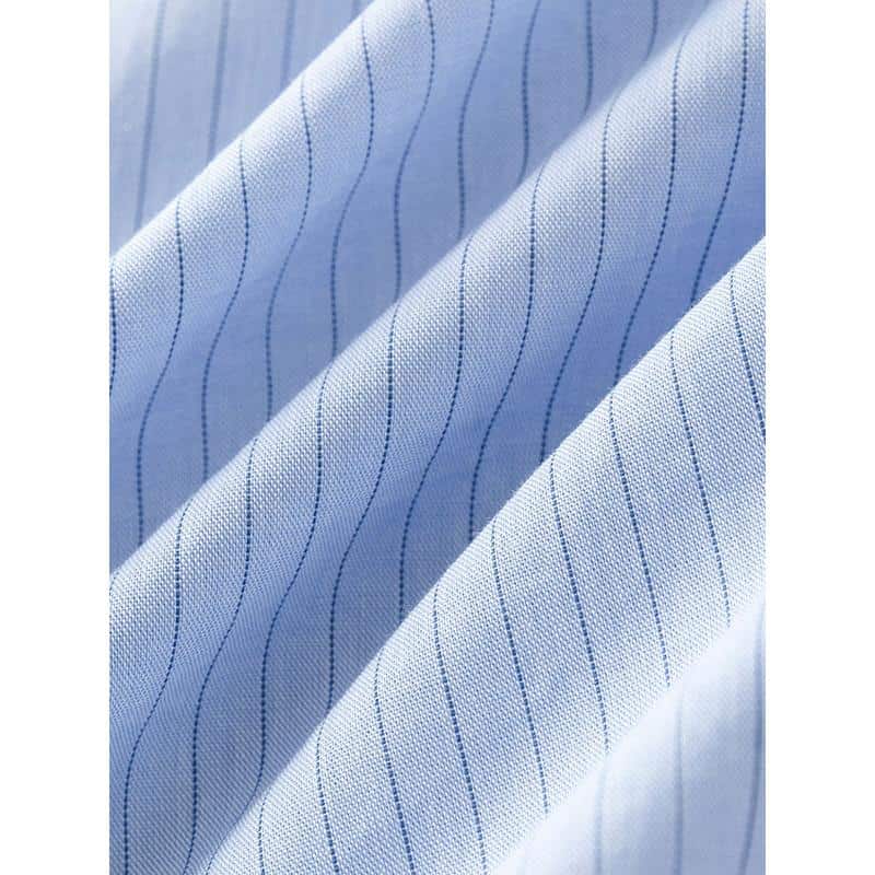 Close-up of a light blue men's dress shirt fabric with navy pinstripes, showing fine stitching and premium quality material ideal for tailored shirts.