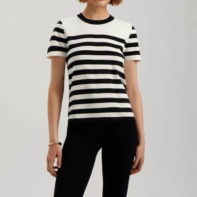 Optical striped women’s t-shirt from Monalisa Store featuring classic black and white design, perfect for casual or workwear. Comfortable, trendy, premium quality apparel for fashionable women.