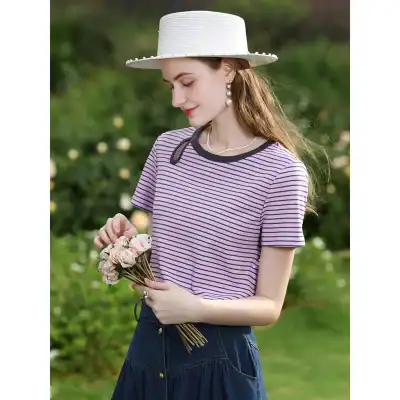 Meticulously crafted women's striped top featuring comfortable fit and chic design, perfect for daytime outings. Paired with jewelry and a wide-brimmed hat, it offers a fashionable look. Ideal for leisure or casual occasions, this clothing piece emphasizes style and comfort. Great for fashion-conscious women seeking trendy, versatile apparel for spring and summer wear.