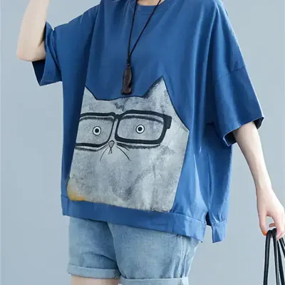 Comfortable oversized blue T-shirt with a cute cat graphic and glasses print, perfect for everyday wear and trendy street style.