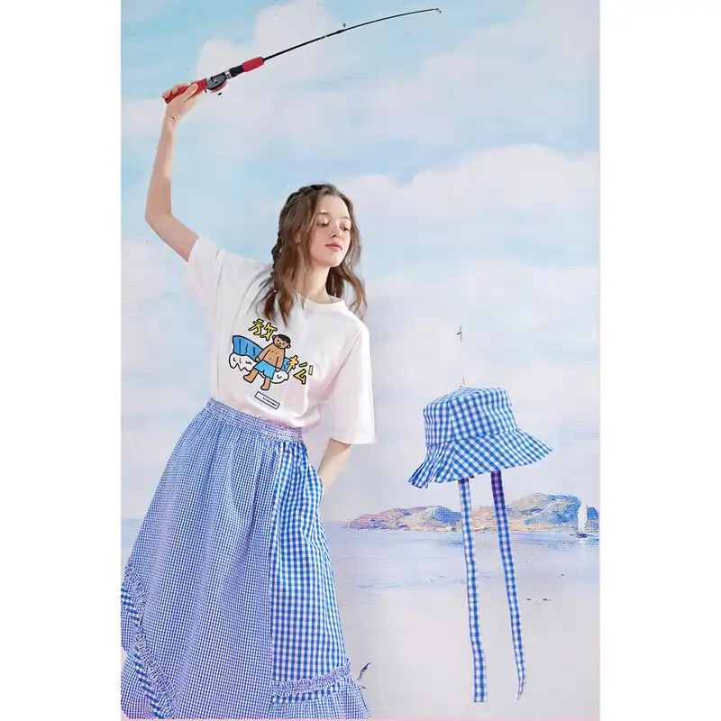 Young woman in trendy summer outfit holding fishing rod at beach, showcasing vibrant, stylish clothing for opt.